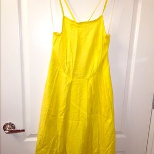 NWOT YELLOW SUMMER DRESS WITH CRISSCROSSED BACK